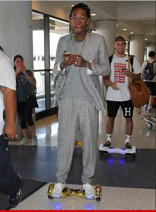 Rude Boy!! Wiz Khalifa Still Riding his Hoverboard At The Los Angeles Airport [See Photo]